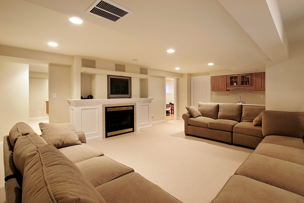 Photo of a basement remodel NJ project with white flooring and beautiful furniture.
